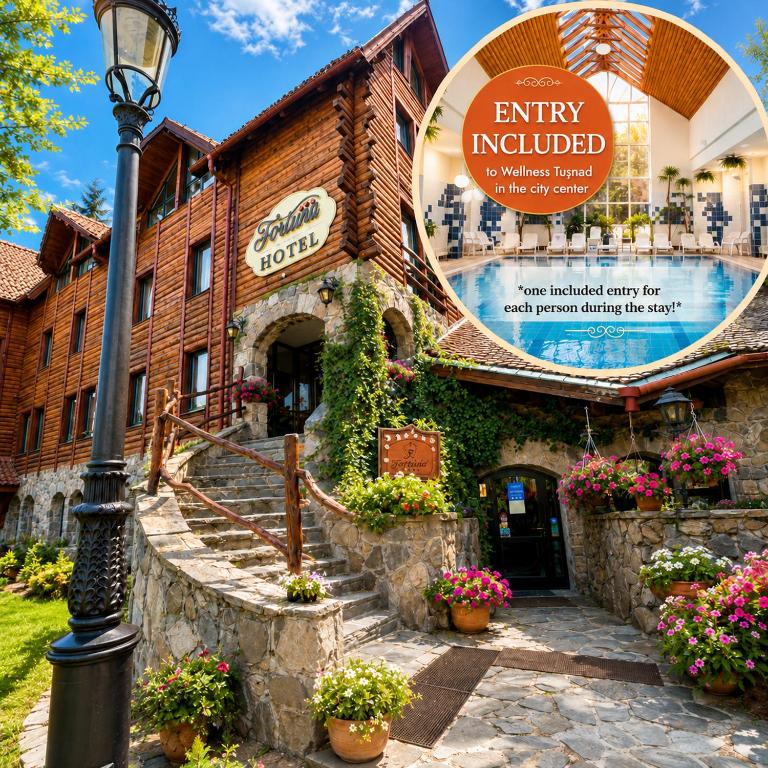 a building with a sign that reads entry included at Fortuna Eco - Boutique Hotel in Băile Tuşnad