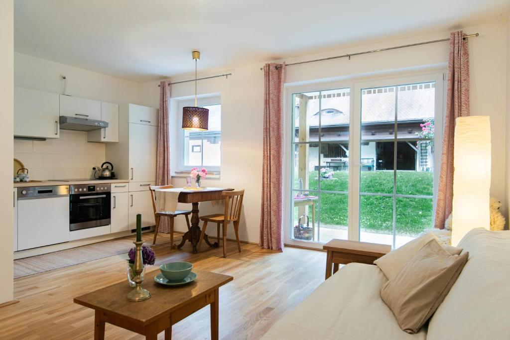 a living room with a couch and a table at Appartment am Mondsee in Mondsee