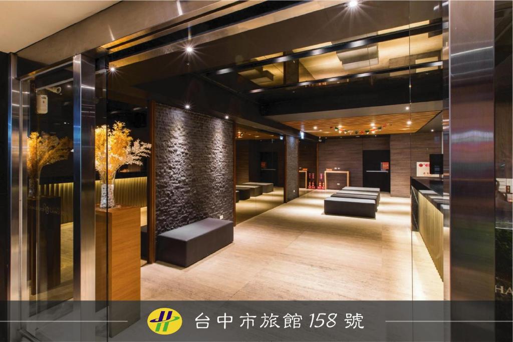 a lobby of a building with chairs and tables at Chance Hotel in Taichung