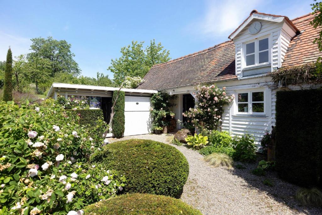 a white house with a white garage at Gästehaus Altes Forstamt Sinntal in Sinntal