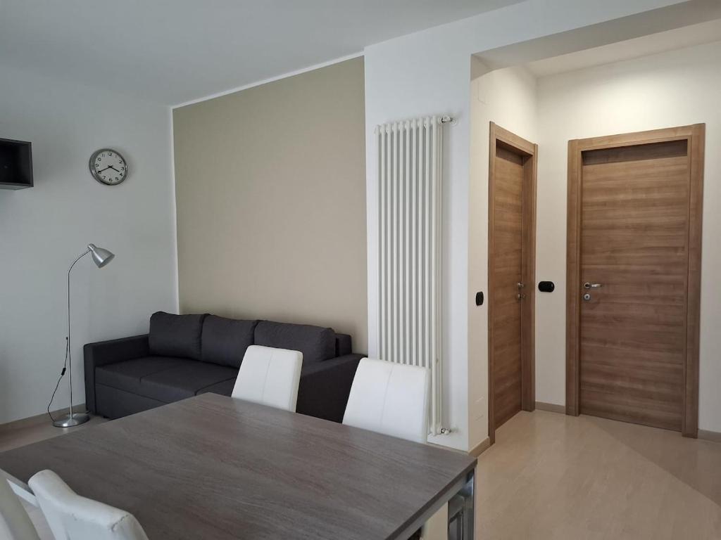 a living room with a couch and a table at Eira Apartment Potenza in Potenza