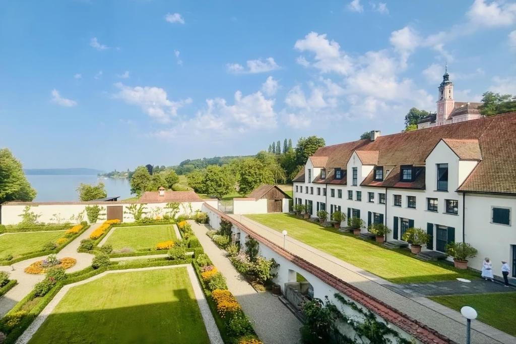 an aerial view of a mansion with a garden at Bodensee-Schloss Maurach in Uhldingen-Mühlhofen