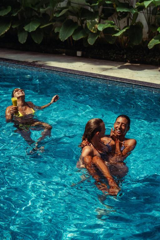 a group of people in a swimming pool at Paddle Cult Surf & Yoga in Varkala