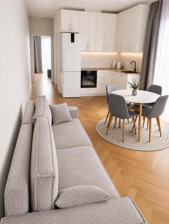 a living room with a couch and a table at Wake&wave in Užpelkiai