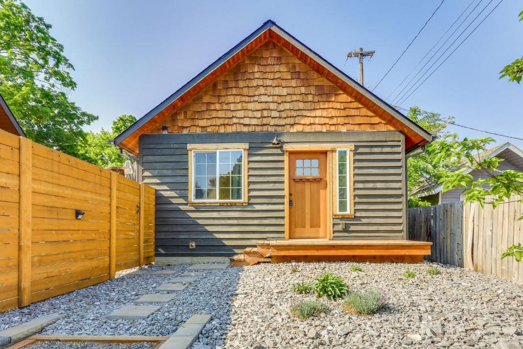 a small house with a wooden fence in front of it at The Nook in Coeur d'Alene