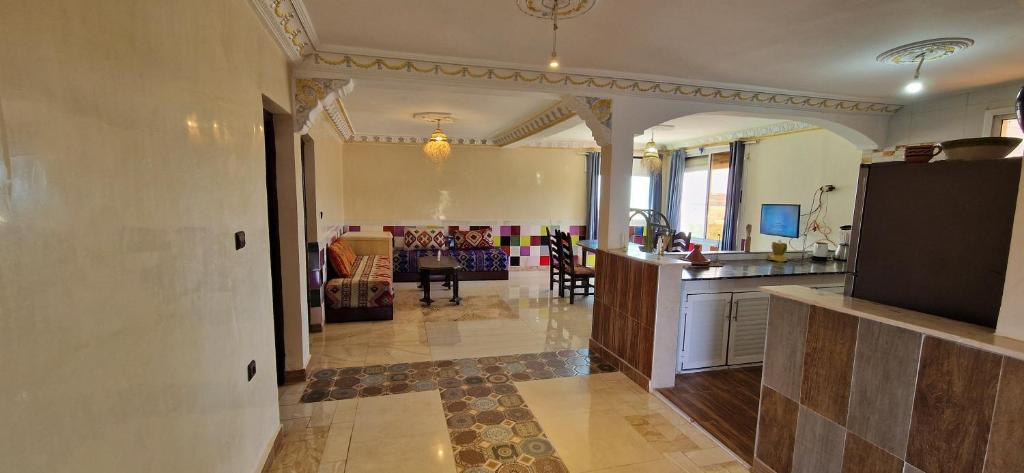 a room with a kitchen and a living room at Villa Galactik Pegasus in Tamraght Ou Fella