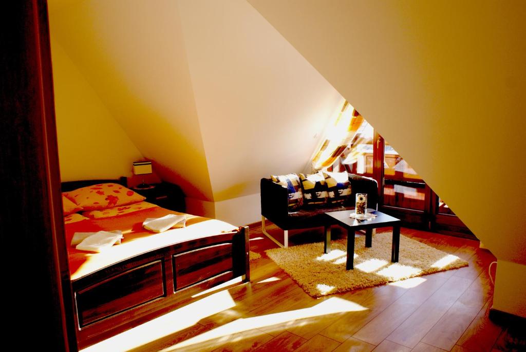 Posteľ alebo postele v izbe v ubytovaní Apartament Słoneczny Koscielisko