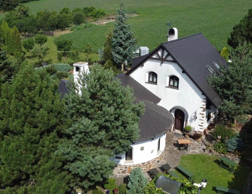 an overhead view of a white house with a black roof at Rotunda U Václava in Šebkovice