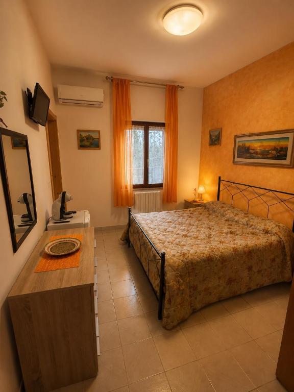 a bedroom with a bed and a table in it at Dream Beach Salento in Porto Cesareo