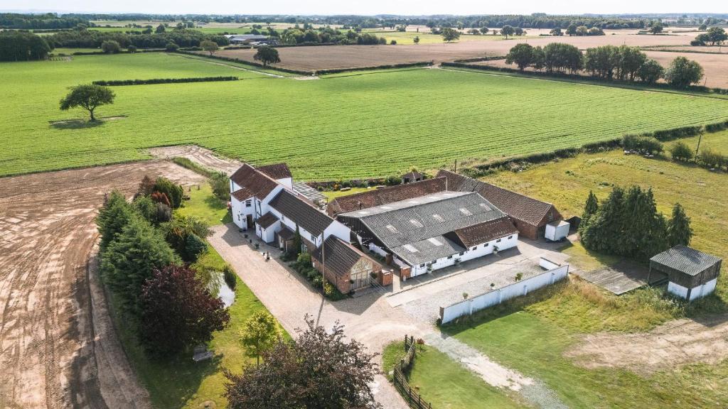 an aerial view of a large house in a field at Deighton Lodge in York
