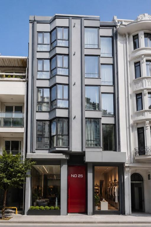 a large white building with a red door at No25 Suites Nisantasi in Istanbul