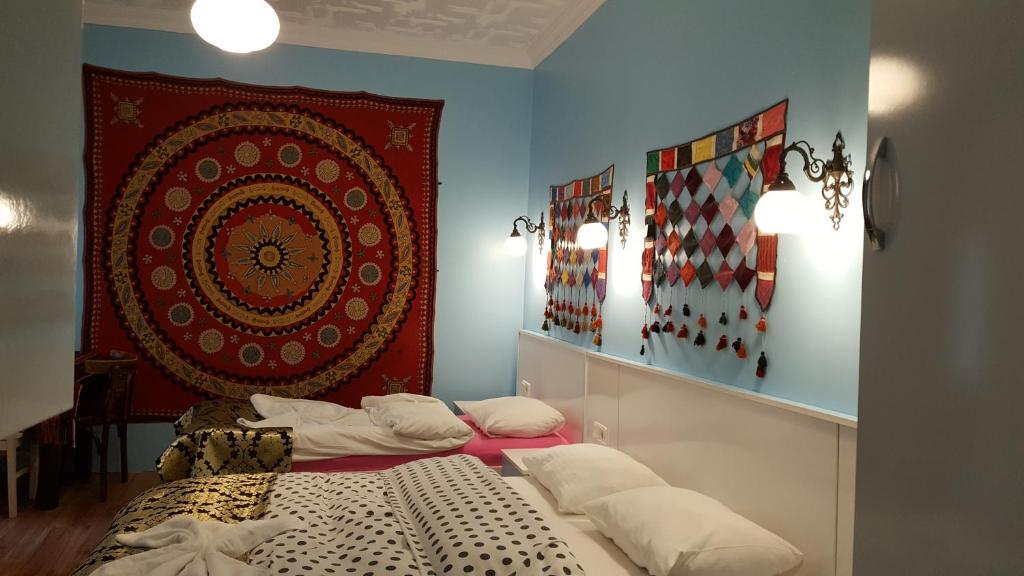 A bed or beds in a room at Tulip Guesthouse