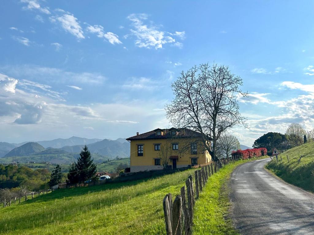 a house on a hill next to a road at El Balcón Del Profesor in Cereceda