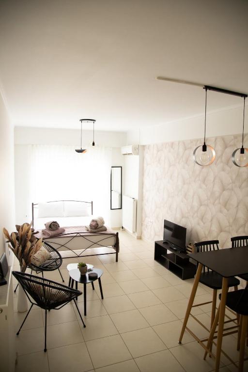 a living room with a couch and a table at Iasonas Apartment 2 in Nafplio