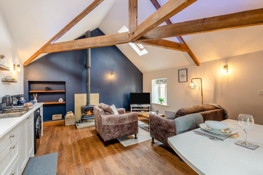 a kitchen and living room with wooden beams at 1 Bed in Crakehall oc-o30357 in Crakehall