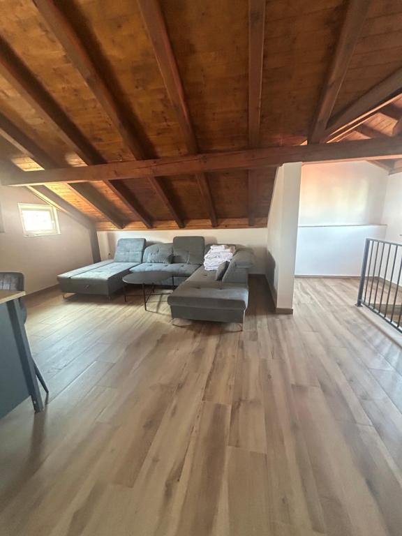 a living room with two couches and a wooden ceiling at Villa Maria III in Vodice