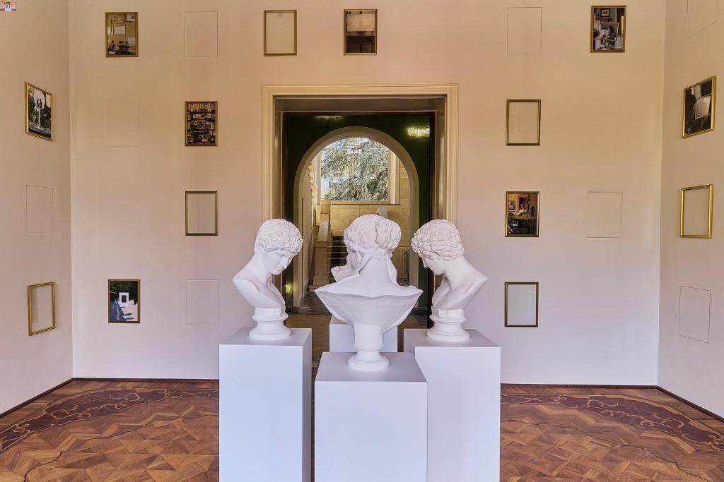a group of white sculptures on display in a museum at CASABIANCA Suites in Como