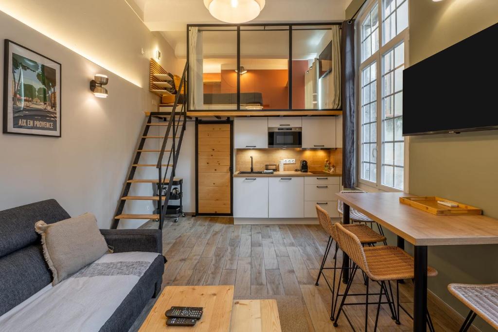 a loft apartment with a kitchen and a living room at Duplex Mirabeau - Hyper center city - Calm in Aix-en-Provence