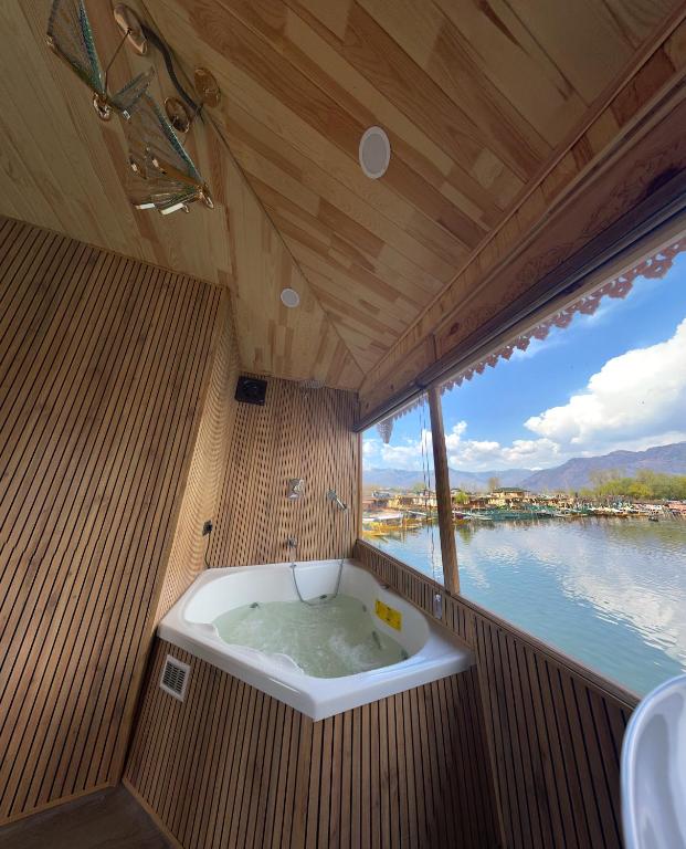 a bath tub in the middle of a boat at Smith Palace Group Of Houseboats in Srinagar