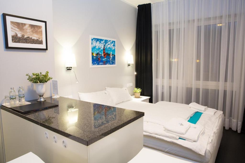 Postel nebo postele na pokoji v ubytování HOTEL Amber Suite & SPA - Enklawa dla Dorosłych