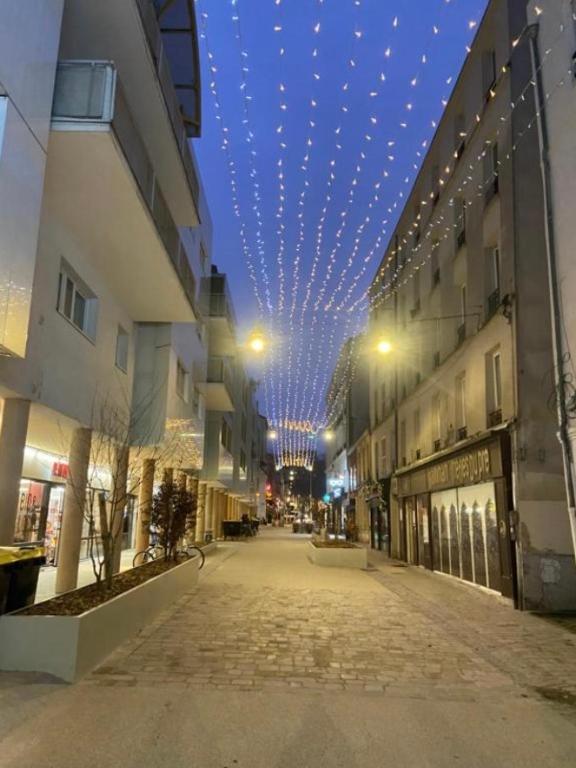 an empty street with a ceiling with lights at Les Marais 2 in Le Pré-Saint-Gervais