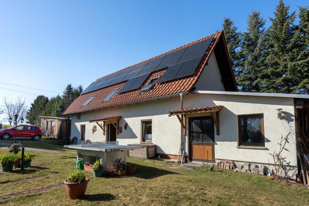 a house with solar panels on the roof at Kottmar in Herrnhut