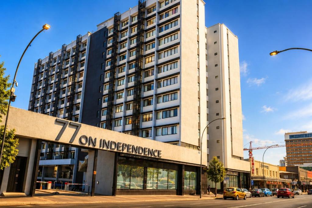 a tall building with a sign that reads turn on independence at MariSal at 77 Independence avenue CBD in Windhoek