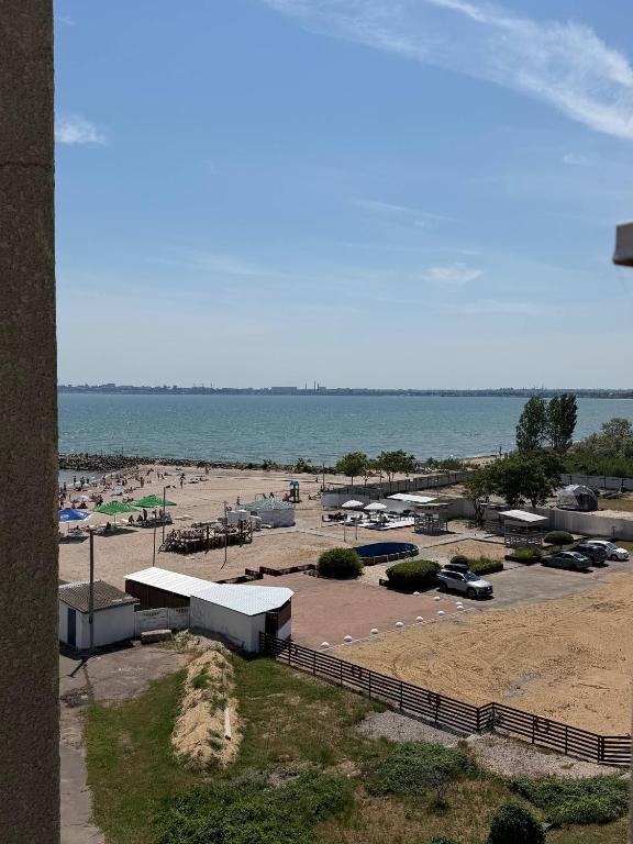 a parking lot with a beach and the ocean at Мрія in Odesa