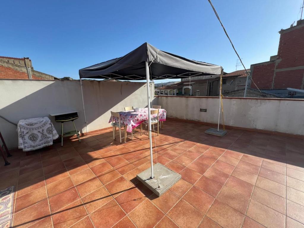 a tent on the roof of a building at La casa di Cleo in Gonnesa