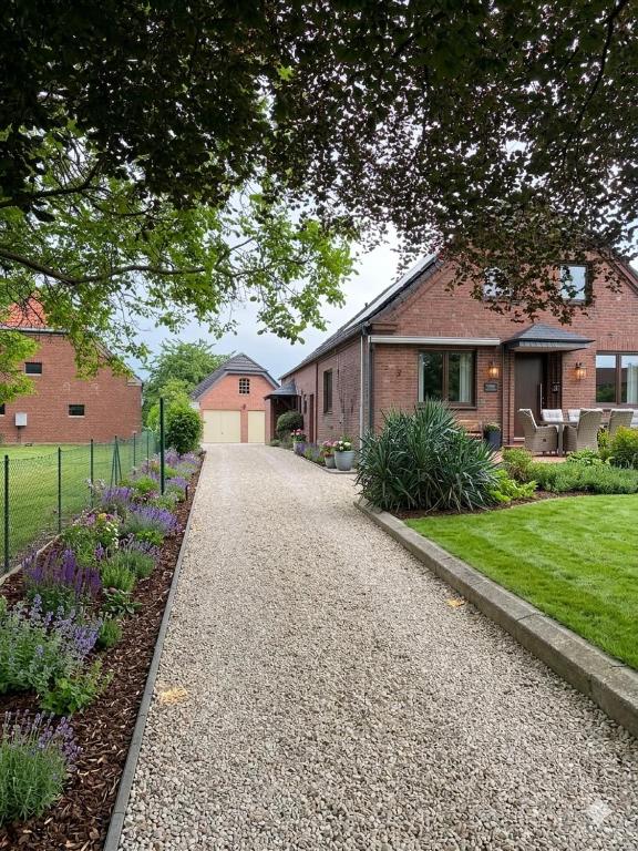 a driveway leading to a house at Modernes Landhaus Modern country house in Kalkar