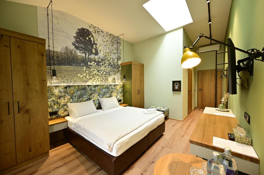 a bedroom with a bed and a table in it at Wald & Wiese Hornstein in Hornstein