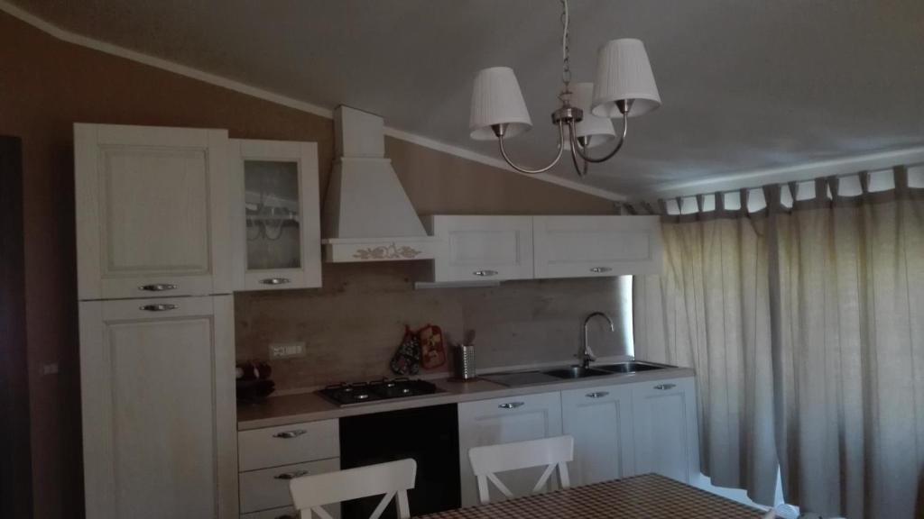 A kitchen or kitchenette at Casa Vacanze Villa Rosetta