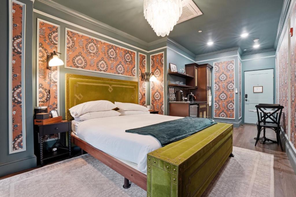 a bedroom with a large bed and colorful walls at The Gas Lamp Hotel in Philadelphia