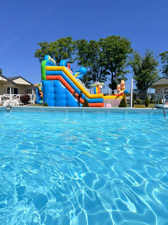 a water slide in a swimming pool at Holiday Camp Sarbinowo in Sarbinowo