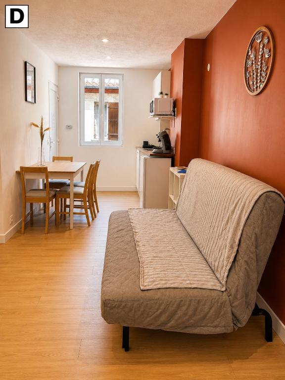 a living room with a couch and a table at Notre Dame in Perpignan