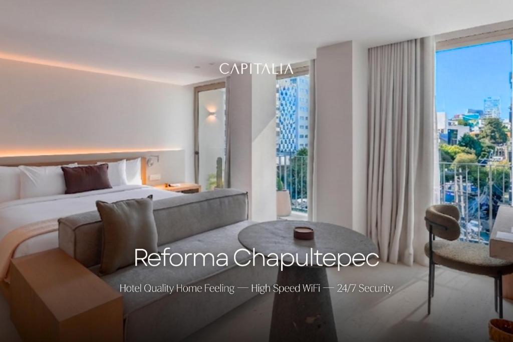 a bedroom with a bed and a large window at Capitalia Reforma Chapultepec in Mexico City