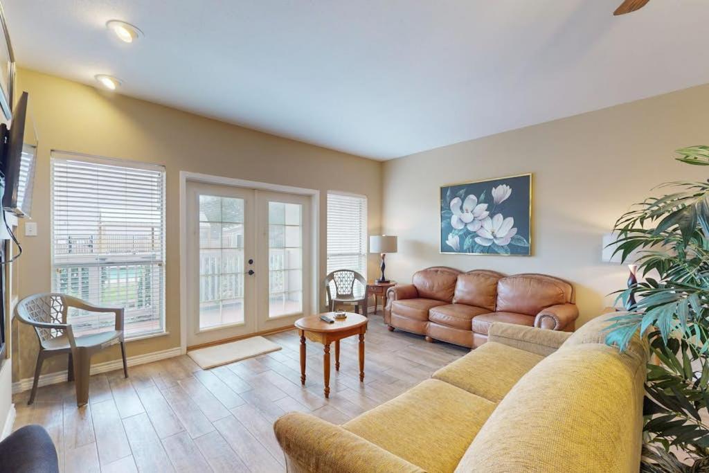 a living room with a couch and a table at Mariner Village 108 in Seabrook