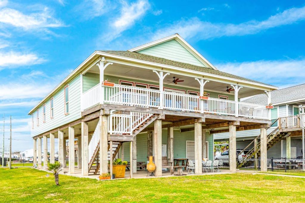 a large white house with a large deck at Reel Paradise in Bacliff