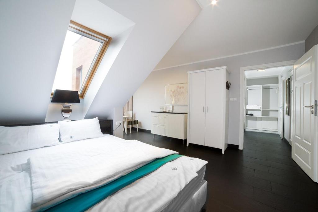 Postel nebo postele na pokoji v ubytování HOTEL Amber Suite & SPA - Enklawa dla Dorosłych