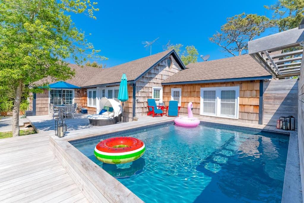 a swimming pool with a toy in front of a house at 15 Seneca in Ocean Bay Park