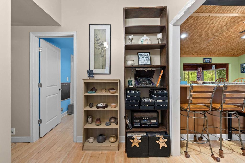 a room with a shelf with shoes in it at Cozy waterfront cabin with fire pit in Old Hickory