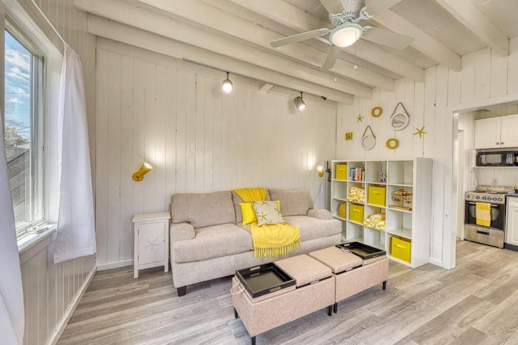 a living room with a couch and a table at The Surfcomber Unit 1 in Ocean Bay Park