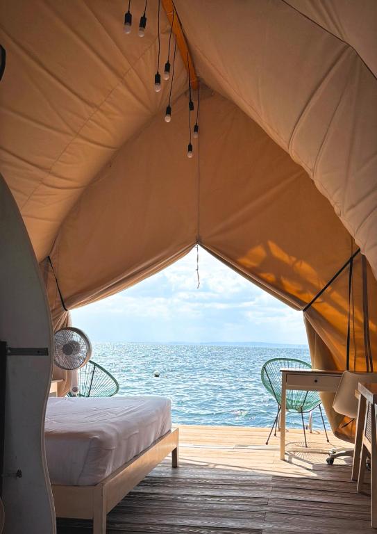 a tent with a view of the ocean at Reef Resort - Mount Apo View Unit B2 in Kaputian