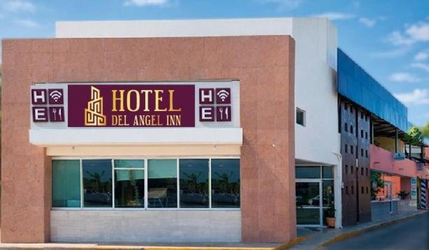 a hotel with a sign on the front of a building at Hotel del angelinn in Martínez de La Torre