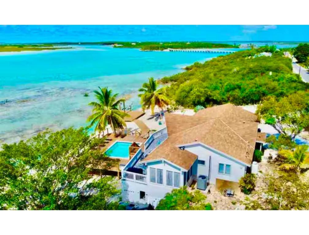 an aerial view of a house on the beach at Beach Villa Blue Bahamas in Mayaguana Island