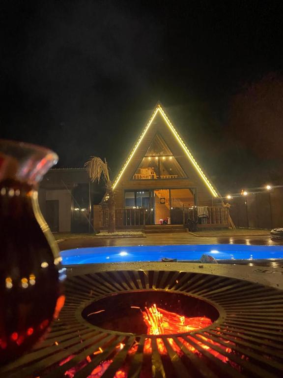 a fire pit in front of a house at night at İstiridye Bungalov in Samsun