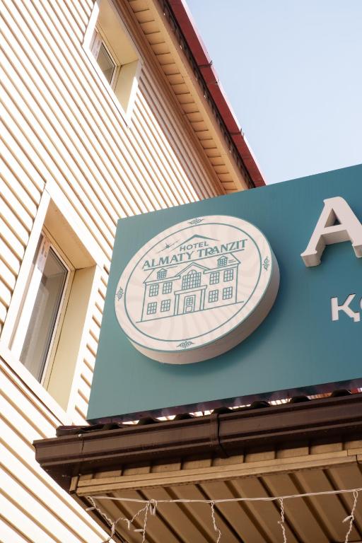 a sign on the side of a building at Алматы Транзит №1 in (( Turksib ))