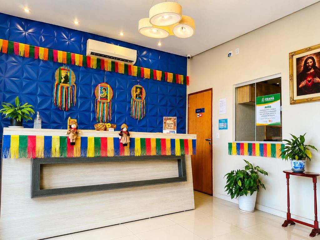 a store front with a colorful counter in a room at Pousada Santo André - O Apóstolo in Juazeiro do Norte