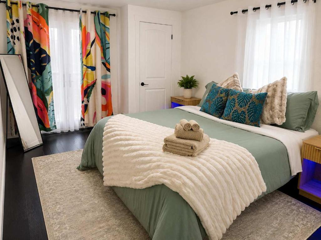 a bedroom with a bed with a towel on it at The Creative Escape With Community Canvas Loft in Coeur d'Alene