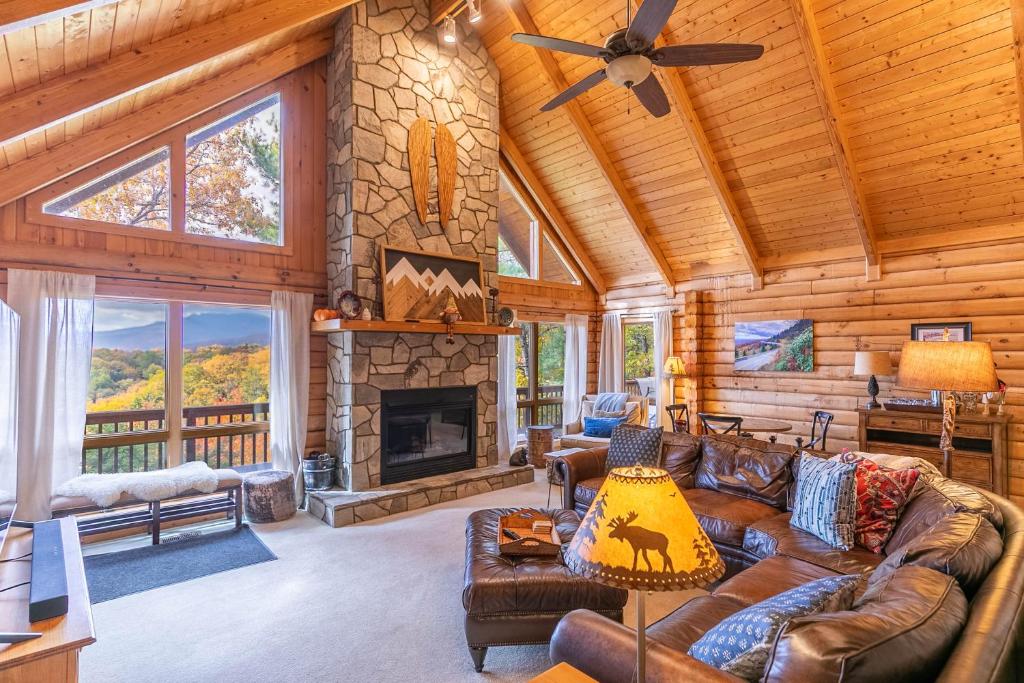 a living room with a couch and a fireplace at Angels Envy in Lenoir